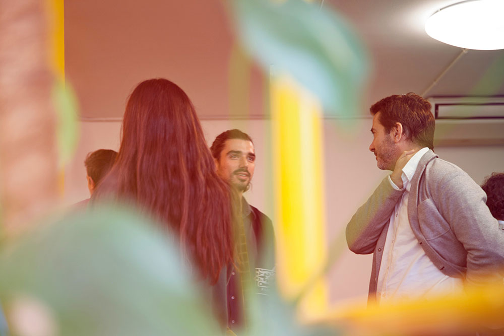 Business people gathered around networking.